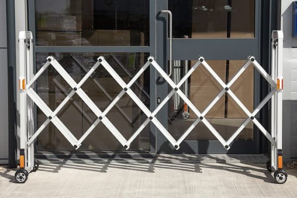 Expandable barrier outside front doors 
