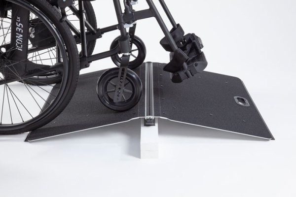 Butterfly ramp with a manual wheelchair going over it 