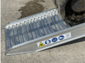Foot of the loading ramps resting on the ground 