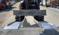 vehicle ramps resting on van 