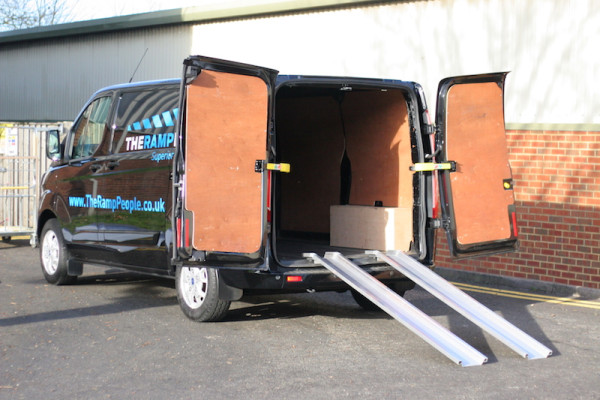 Aluminium channel ramps resting on a van 