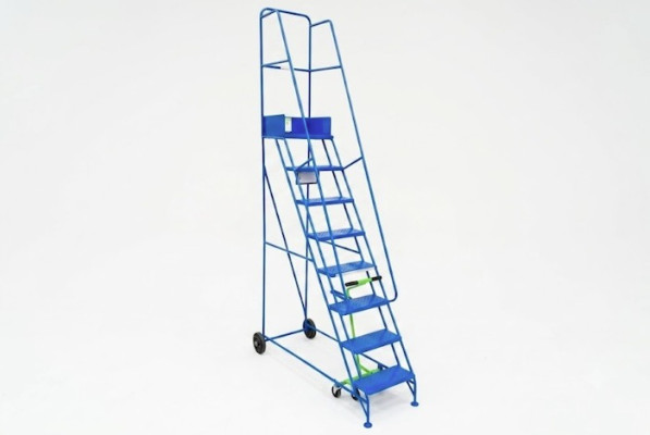 Narrow steel mobile warehouse ladder with 8 treads. Blue steel ladder with dual handrails and wheels. 