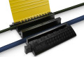 Adam Hall Defender ULTRA L 4 channel hose protector with cables running through 