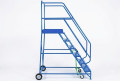 Side view of the heavy duty mobile ladder on wheels with dual handrails and platform