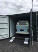 Caravan loaded into container using container ramps 