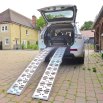 Motorcycle loading ramps on car 