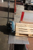 Pallet being loaded on loading bridge 