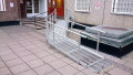Modular wheelchair ramp in front of building 