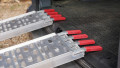 Pair of ramps resting on vehicle