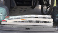 Folded loading ramp in boot of van 
