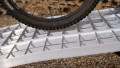 close up of the surface of an extra wide bike ramps kit resting on a vehicle