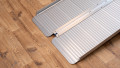 Base of the economy folding ramp resting on the ground to provide smooth entry onto the aluminium ramp 