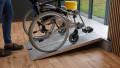 Manual wheelchair going up a portable wheelchair ramp