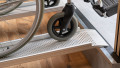 Close up of the rest on connections of low Profile Edge Channel Ramps resting on a step used for a wheelchair or mobility scooter