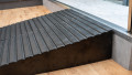 A close up of the grip surface of a pair of rubber threshold ramp used to overcome step in home