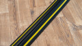 1 channel black and yellow cable protector laid on a wooden floor