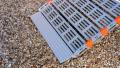 Close up of rollAble Ramp food end on a gravel surface