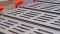 Close up of surface on a step of a portable rollable aluminium wheelchair ramp