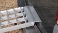 Folding extra wide motorcycle loading ramp, close up of rest on connection