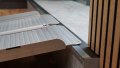 close up of side view of single fold wheelchair ramp rest on connection