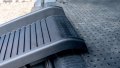 Close up of the rest on connection of a black portable dog ramp resting on the boot of a car
