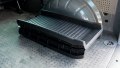 black folding pet ramp folded up and stored in the boot of a car