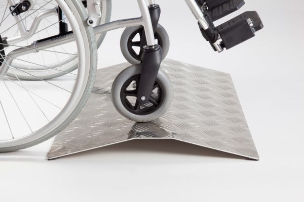 Wheelchair on aluminium ramp 