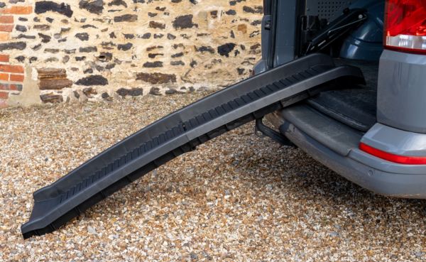 black folding pet ramp resting on the boot of a car