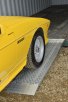 Car on aluminium car loading ramps 