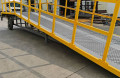 Mobile yard ramp with dual handrails yellow
