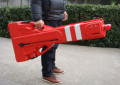 Man carrying the portable safety barrier