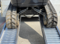 tracked vehicle driving up ramps 