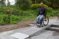 Wheelchair user on modular ramp system 