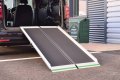 Aerolight Max folding loading ramp resting on car