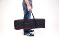 Person carrying telescopic ramps in bag 