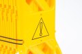 Yellow expandable barrier with warning symbols 