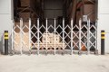Aluminium expandable barrier outside warehouse 