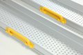 Yellow handles on telescopic channel ramps 