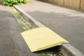 SMC yellow kerb ramp resting on kerb
