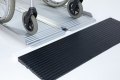 manual wheelchair overcoming threshold with folding ramp and rubber ramp 