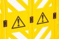 Yellow barrier with warning signs