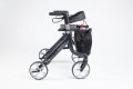 Black rollator with seat, backrest and handles