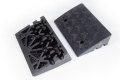 Underneath and top of black rubber kerb ramp