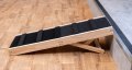 Wooden pet step set up in front of a step