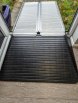 folding aluminium ramp and rubber threshold ramp combined to make a drive in ramp