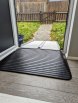Aluminium folding wheelchair ramp paired with a wedge rubber ramp to create a bridge over a door threshold