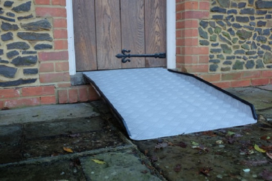 Fixed threshold ramp on front door 