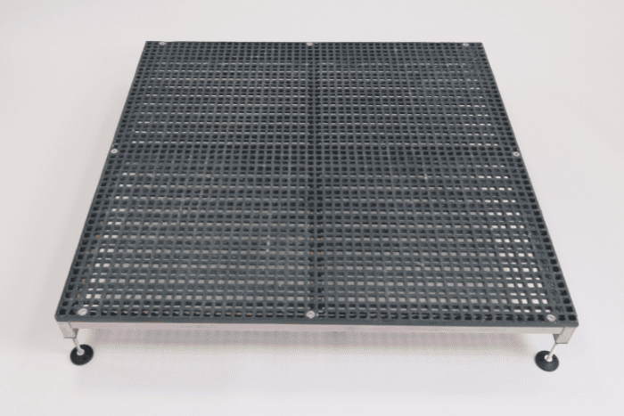 Adjustable half step placed infront of a step