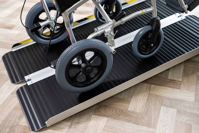 Wheelchair going up ramp 