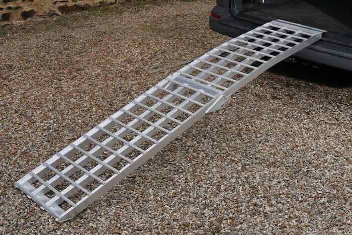 Curved wide motorbike ramp resting on van 